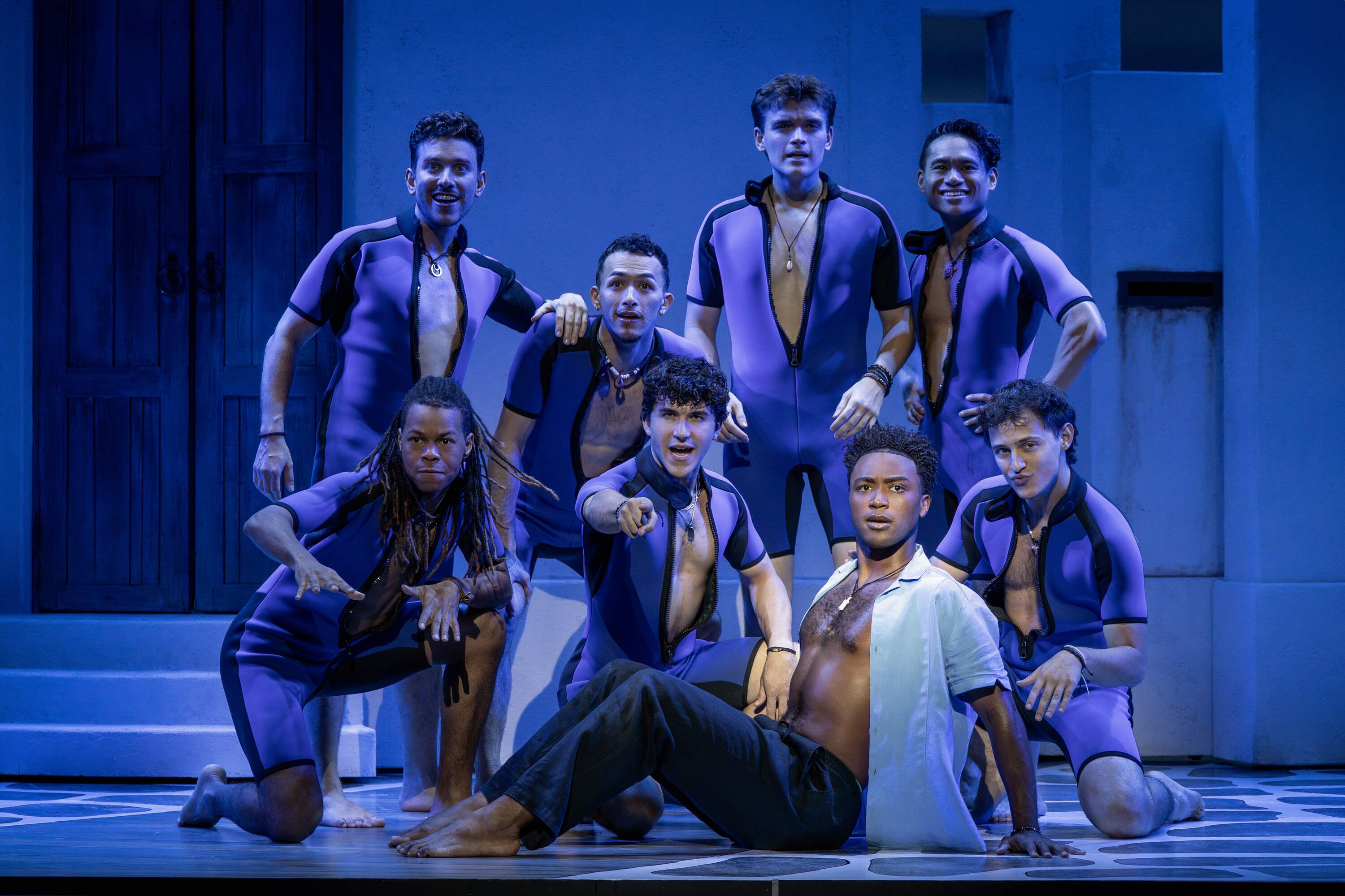 Mamma Mia production photo featuring Grant Reynolds and the company